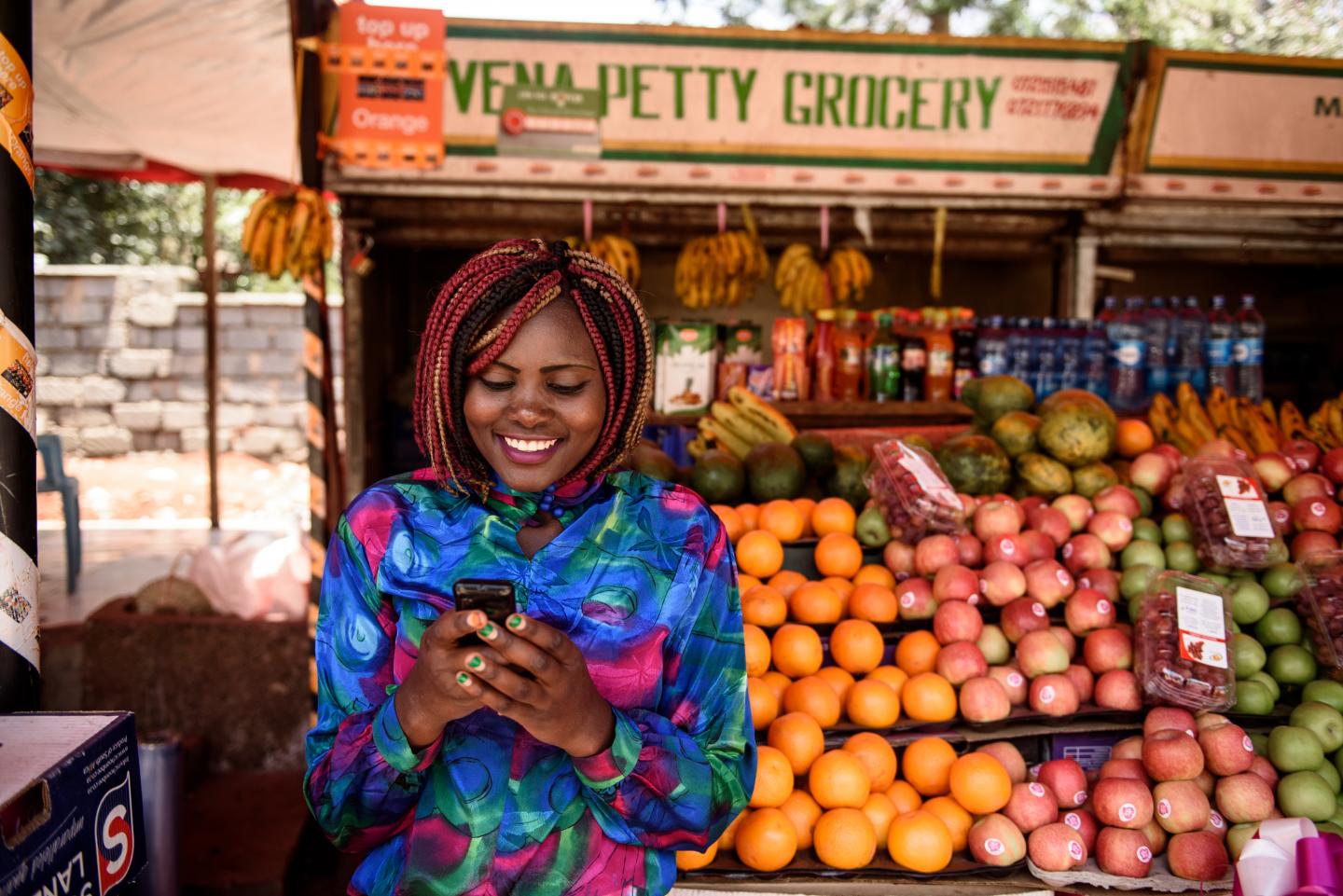 Kenyan woman on phone