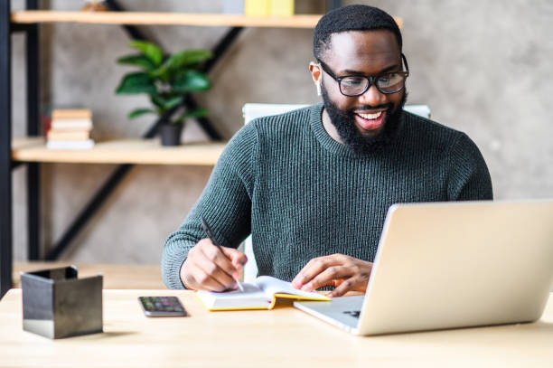 black man using laptop