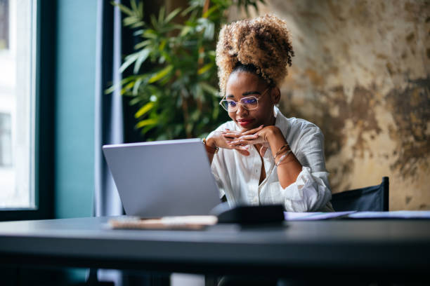 woman looking at laptop