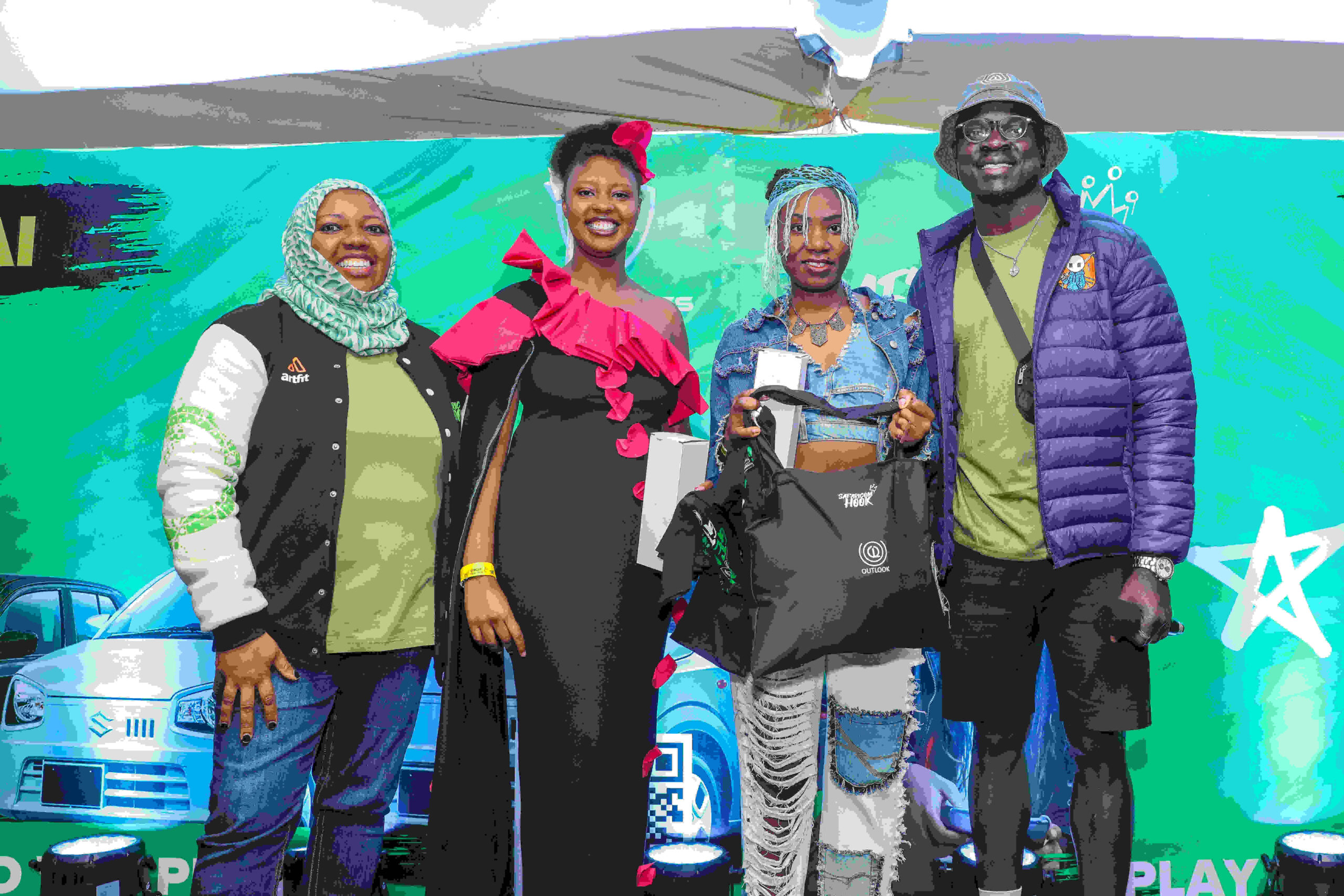 (Left)Fawzia Ali, Chief Business Consumer, Safaricom PLC gifting S-Hook fashion category winner Cynthia Tame (right) alongside fashion mentor (furthest right) OJ (outlook) during the S-Hook Praktiklz Event at Nakuru Athletics Club on Saturday 16 th November,2024.