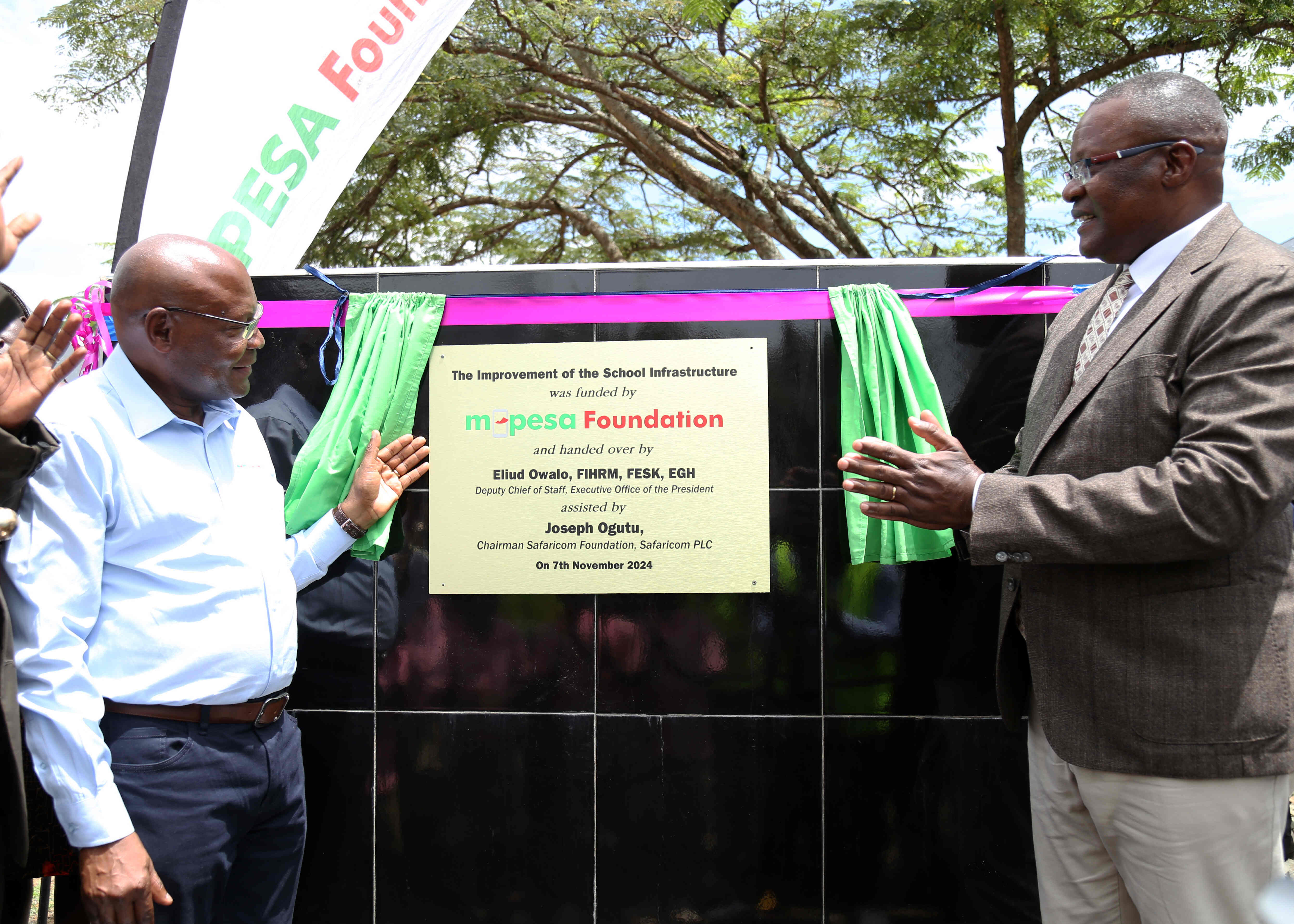 Joseph Ogutu, Chairman of Safaricom Foundation (left), and Hon. Dr Eve Obara, Member of Parliament, Kabondo Kasipul County (right), officially break ground for planned school infrastructure renovations during the groundbreaking ceremony for the infrastructure renovation project at Ober Mixed Primary and Junior Secondary School in Kakelo, Homa Bay County, funded by MPESA Foundation.