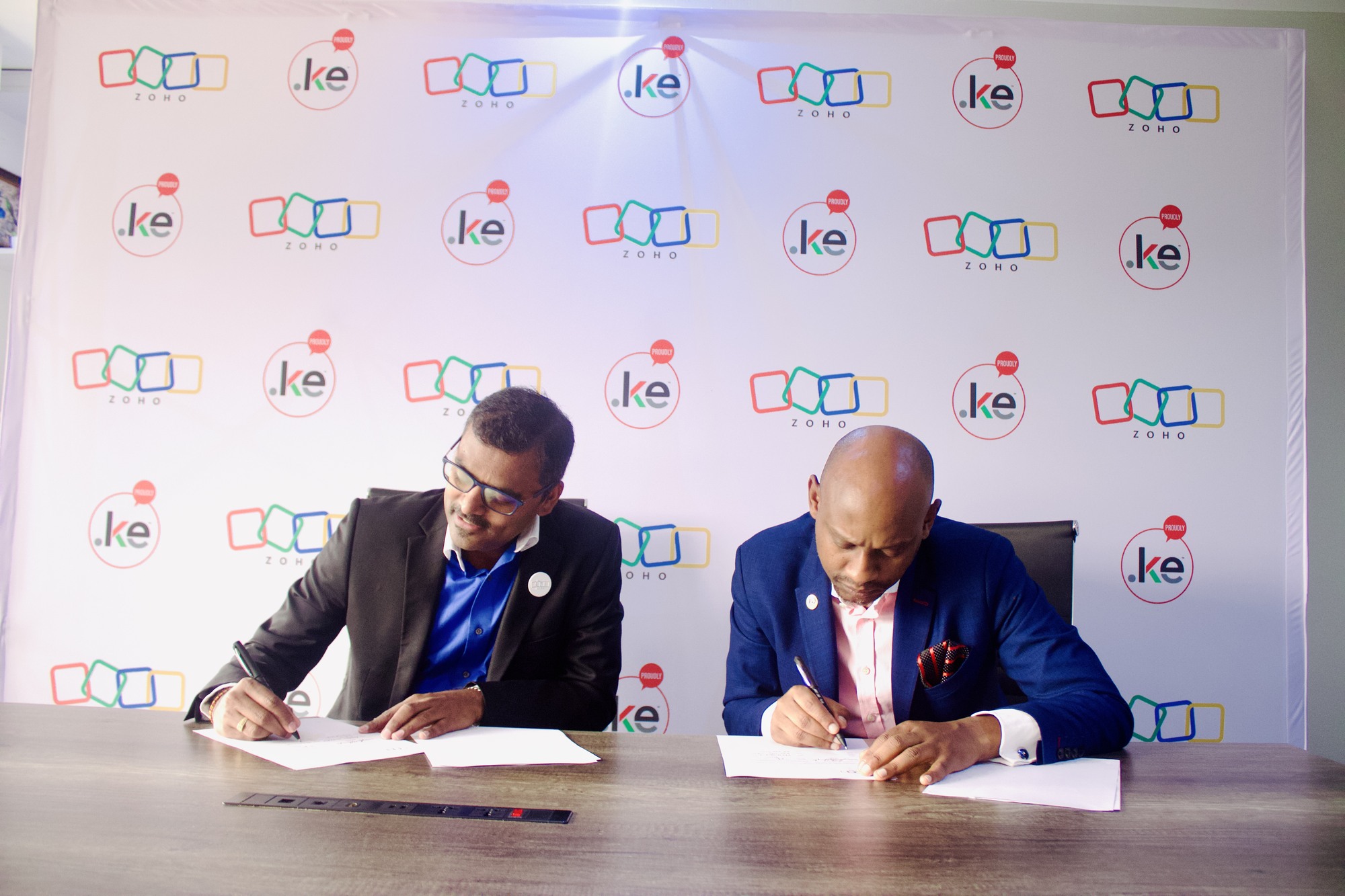 Zoho Regional Managing Director for East Africa Veerakumar Natarajan (left) and Chief Executive Officer The Kenya Network Information Centre (KeNIC) Andrew Lewela Mwanyota, sign a partnership that provides Kenic customers with free Zoho wallet credits worth KES 50,000 as well as training session on digital transformation.