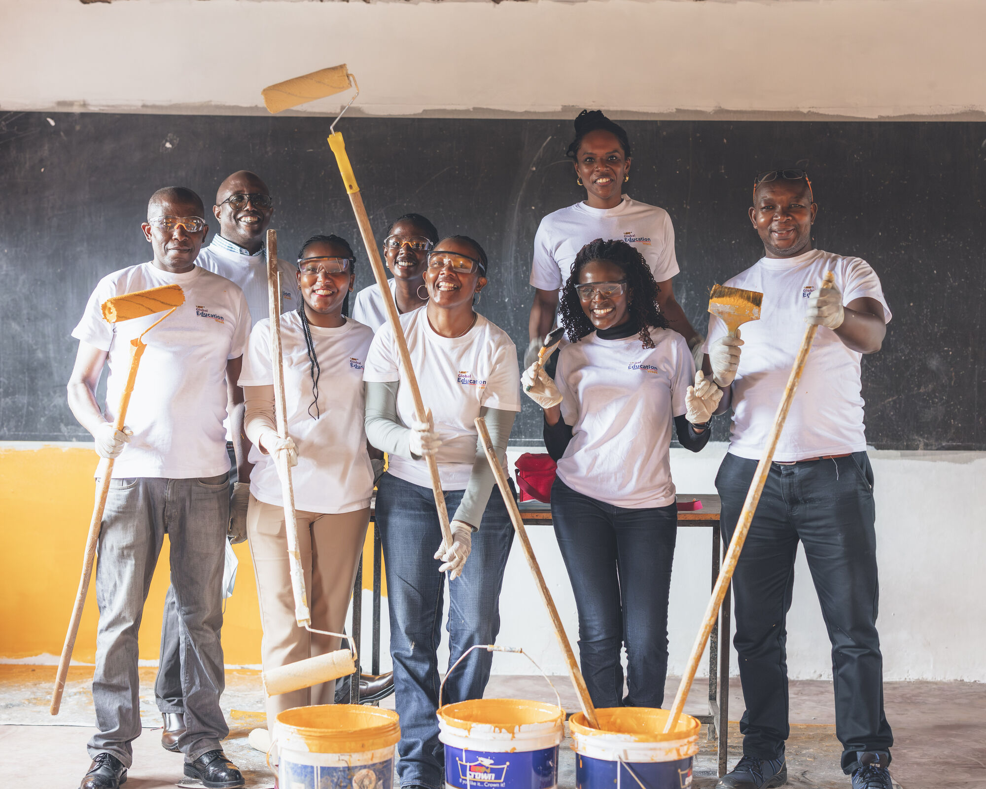 Salome Ngugi, BIC East AFrica Marketing Team Centre with BIC Team Painting Mwiki Primary School, GIthurai (1)