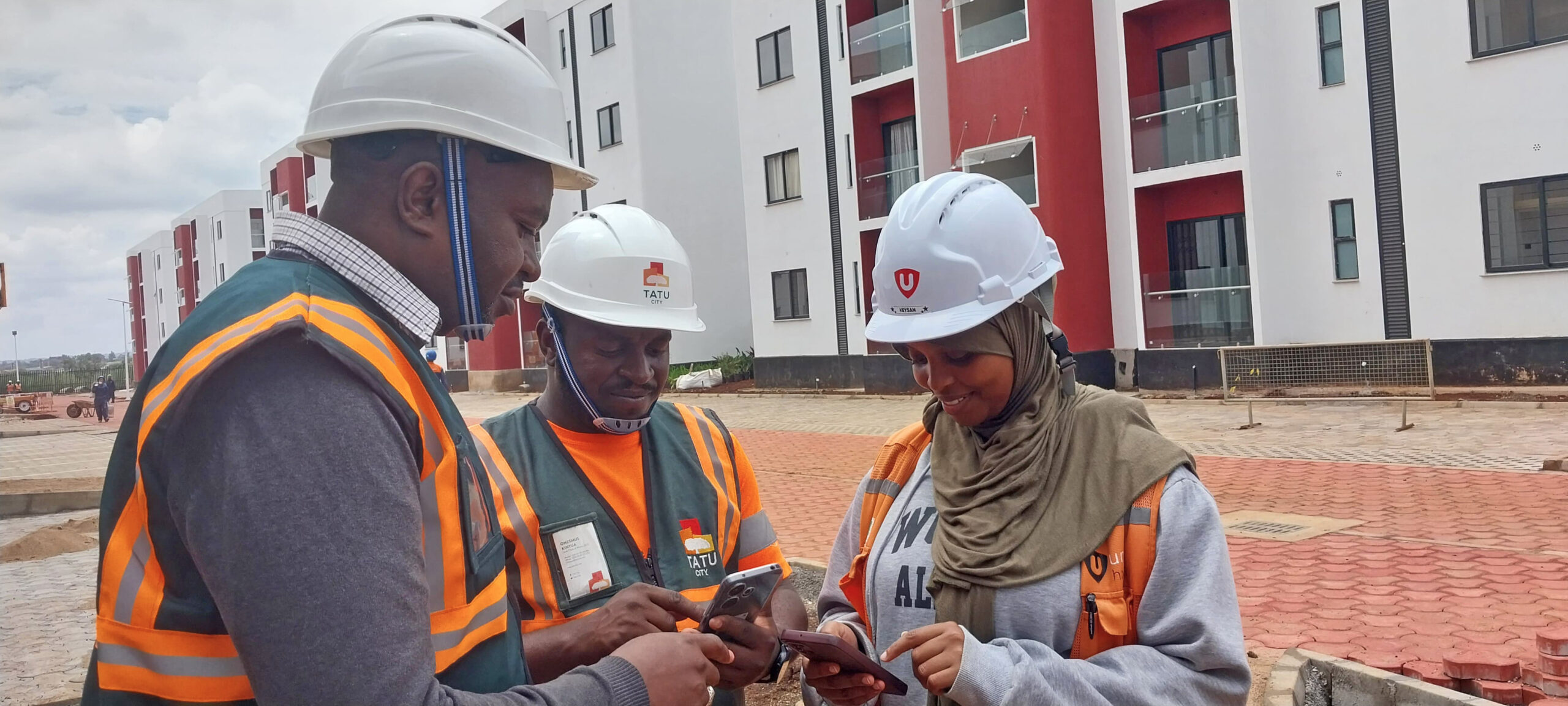 From left, Peter Kamoro - Registration Officer, National Construction Authority (NCA), Onesmus Kinyua - Lead Clerk of Works, Tatu City and Keysan Mohamednur - Site Resource Coordinator, Unity Homes, during a week-long NCA accreditation exercise, where 500 construction skilled workers and site supervisors working at Tatu City were certified.