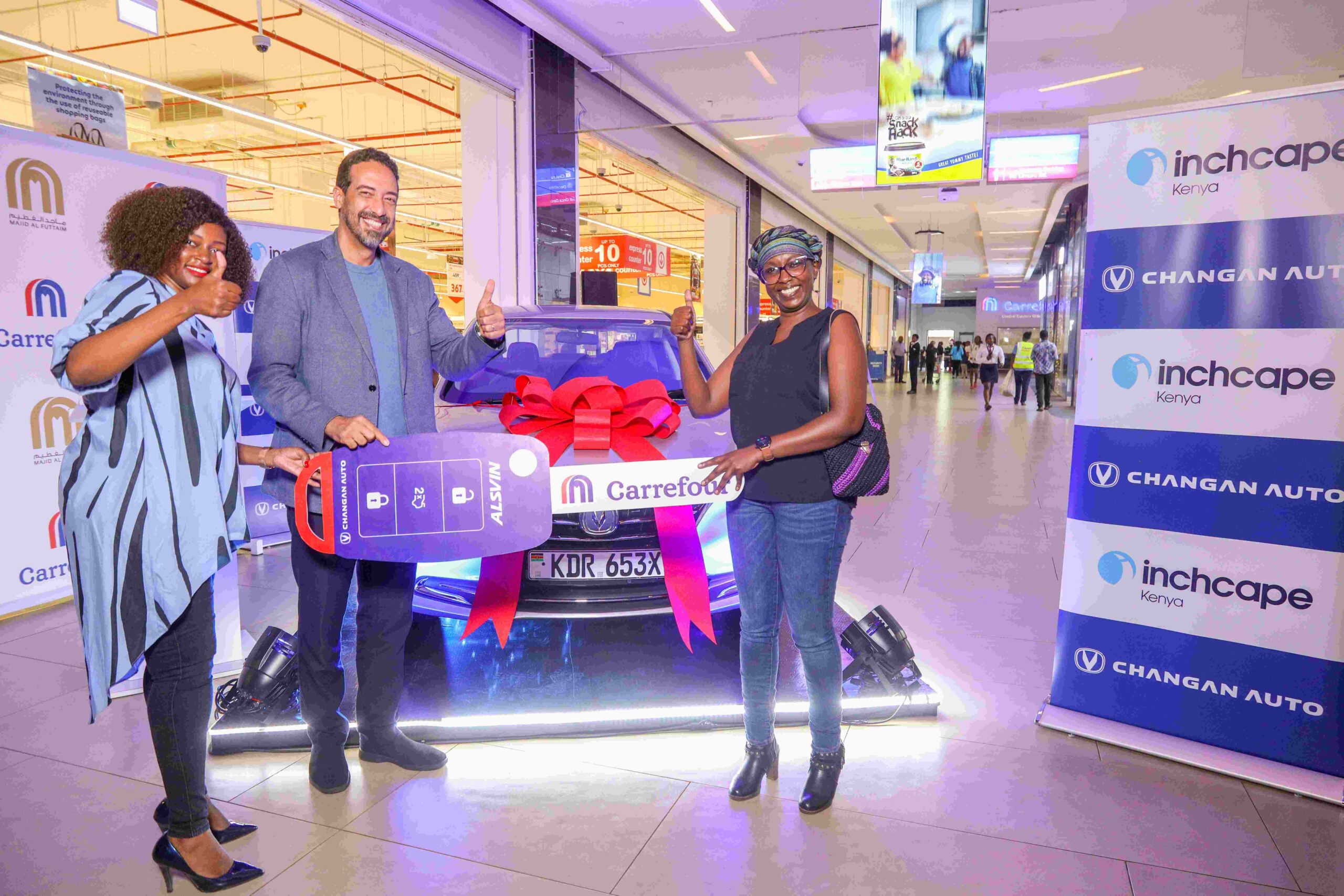 (L) Marketing and Customer Experience Manager, Inchcape Kenya, Anne Wanyeki and Vice President, Finance, Carrefour Kenya, Rachid Nouri officially handing over the key to the Carrefour Black November Grand Prize winner, Sylvia Nyanjui. She walks away with a brand new Changan Alsvin Sedan during the official handover at Two Rivers Mall.