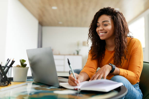 woman in class using laptop