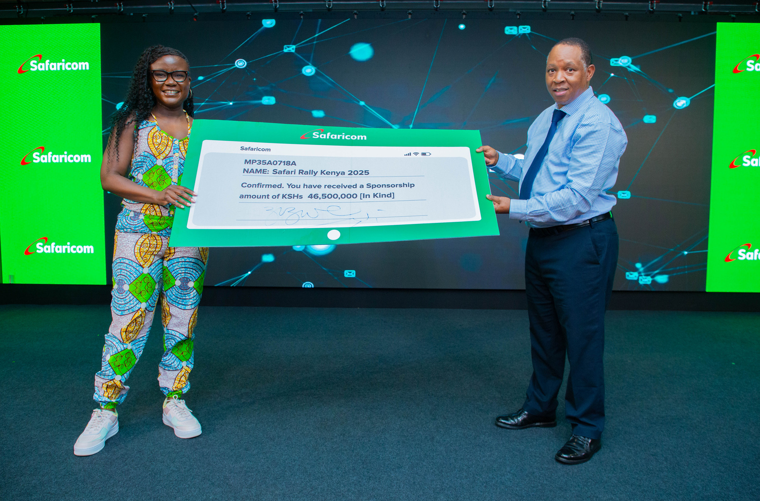 Zizwe Awuor, Director of Branding and Marketing at Safaricom (left) and Charles Gacheru, CEO of WRC Safari Rally Kenya (right), during the cheque handover ceremony where Safaricom announced a KES 46.5 million sponsorship to support the 2025 WRC Safari Rally.