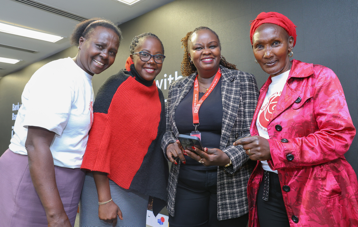 Agnes Kinga (second right) Head of Marketing DTB interacts with (L to R) Ann Gachoka, Magdalene Muthoni and Pauline Njeri a women group from Rose Foundation during a workshop on digital and financial literacy.