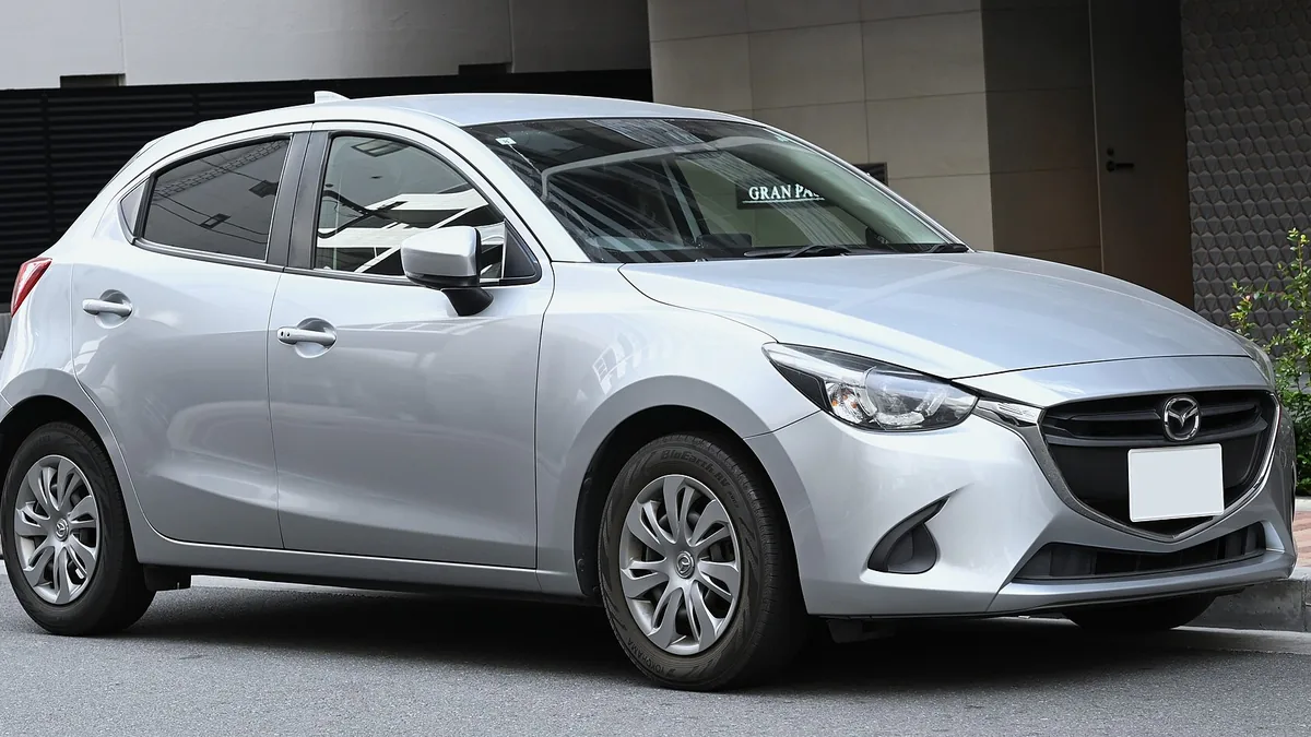 A Mazda Demio, a common Japanese used-car import in Kenya