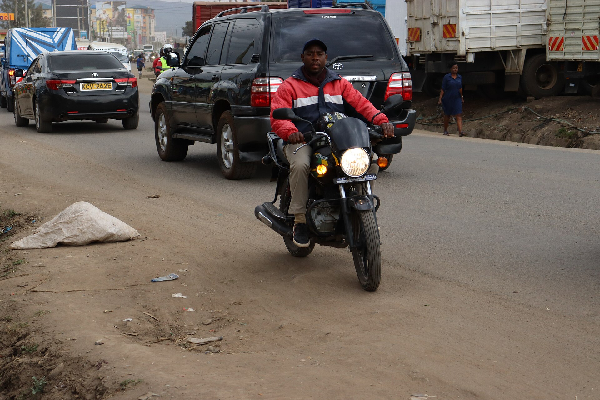A boda boda rider on a Kenyan road