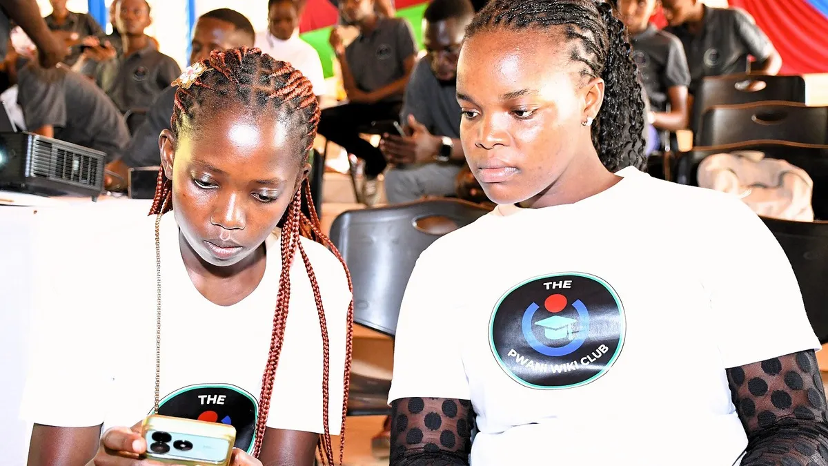 Kenyan university students using their phones – cost of studying computer science and it in kenya