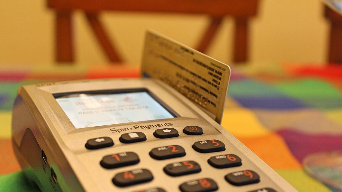 A card payment terminal at a shop counter