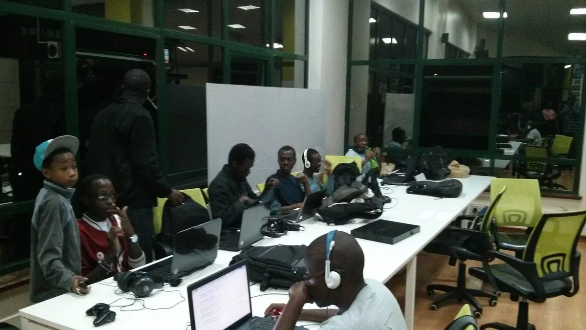 Young Kenyans working on laptops at a Nairobi tech hub – illustrating public libraries in kenya