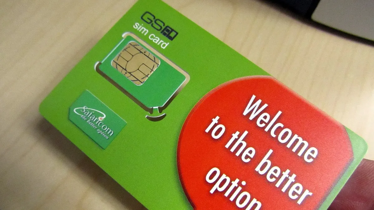 Safaricom SIM card pack in a hand – illustrating reset mpesa pin
