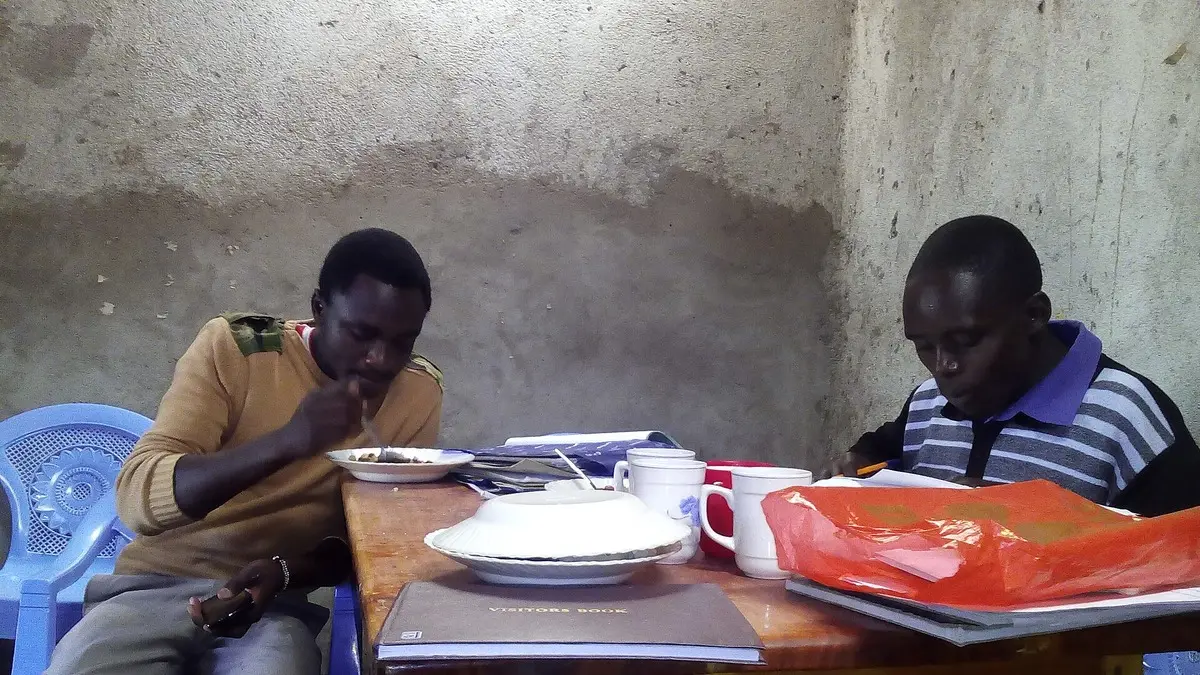 Kenyan teachers at a staffroom table: TSC promotion requirements